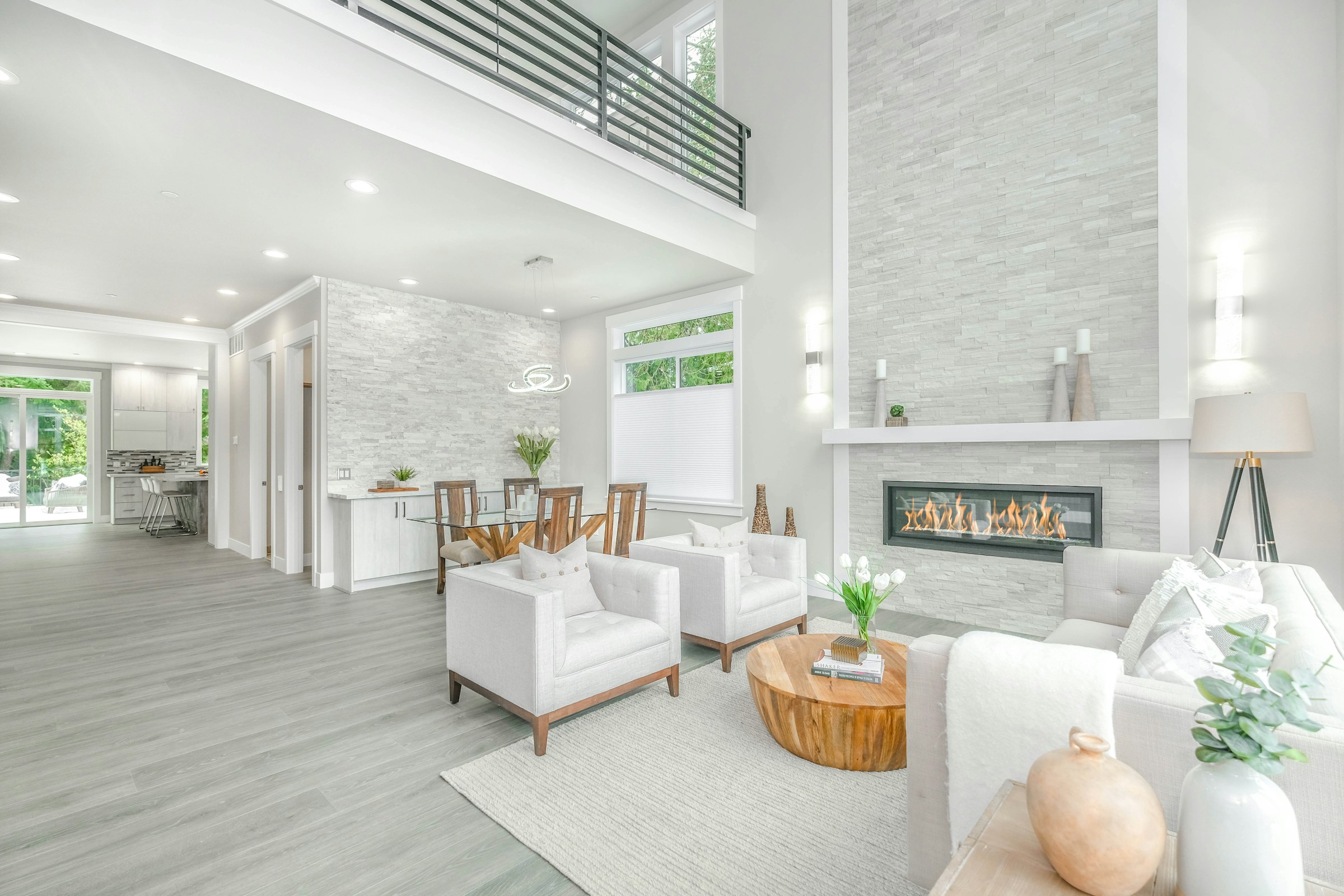 Bright, modern living room with fireplace and open floor plan